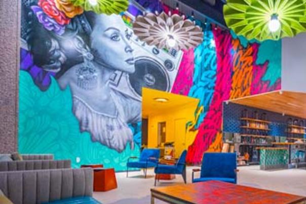 Large mural painted on wall inside museum lobby