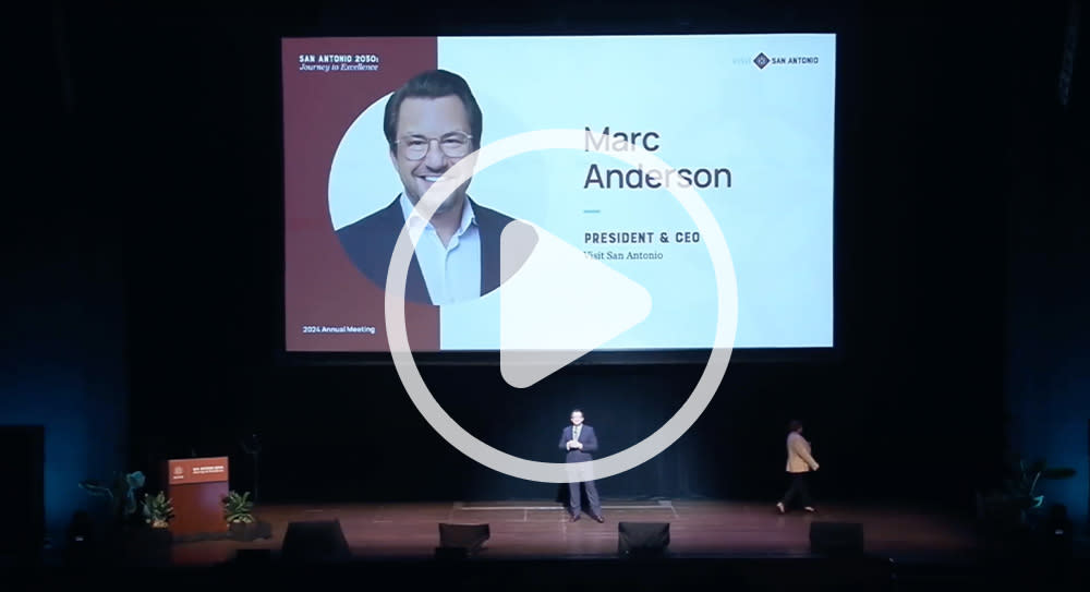 Video still with play button over it