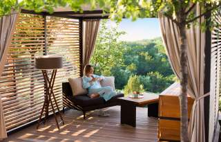 Woman relaxing at La Cantera Resort & Spa with drink