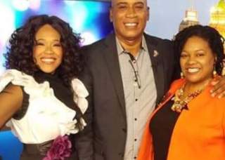 Man and two women smiling